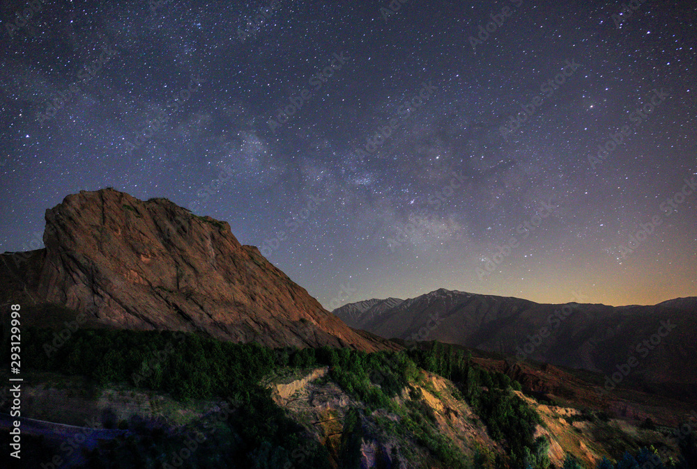 Night landscape. Starry sky with the Milky Way over the mountains. Gazor Khan village, Iran