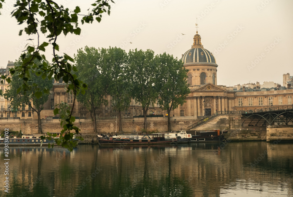 Static shot the RIver Seine and Institut de France in Paris at dawn