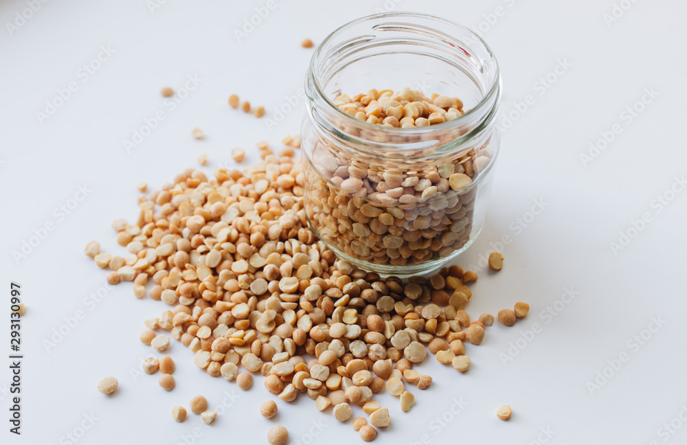 Glass jar with raw dry peas, macro Glass jar with raw dry peas, macro