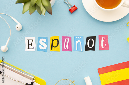 Espanol lettering on blue background photo