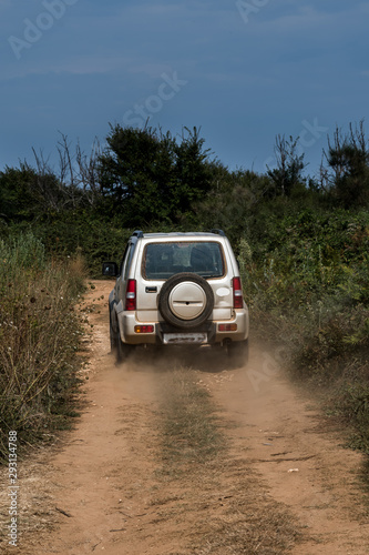 Cross Country Vehicle SUV On Dusty Gravel Road In Croatia
