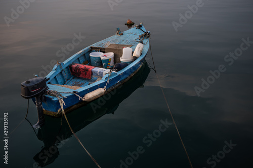 Old Wooden Fisher Boat On Calm Water In Harbor © grafxart