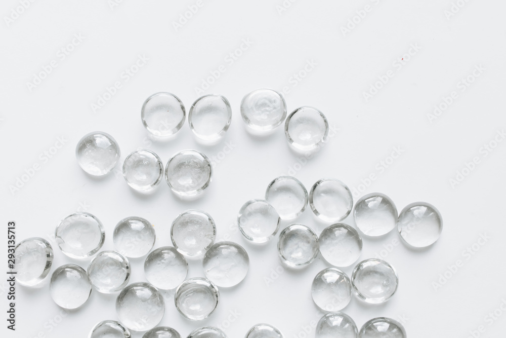 Scattered crystals on white background, beautiful gems Scattered crystals on white background, beautiful gems