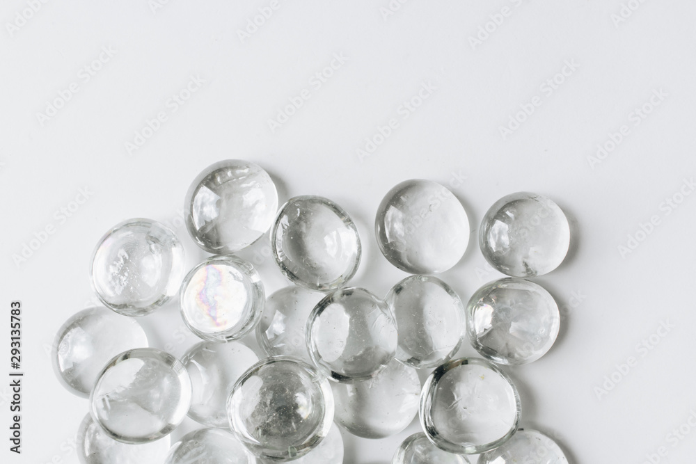 Scattered crystals on white background, beautiful gems Scattered crystals on white background, beautiful gems