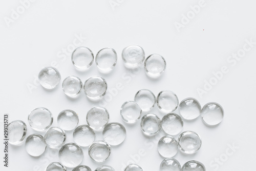 Scattered crystals on white background, beautiful gems