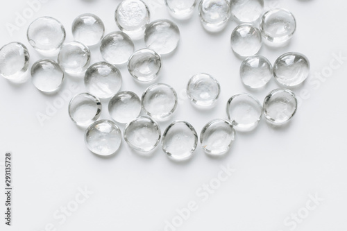Scattered crystals on white background, beautiful gems