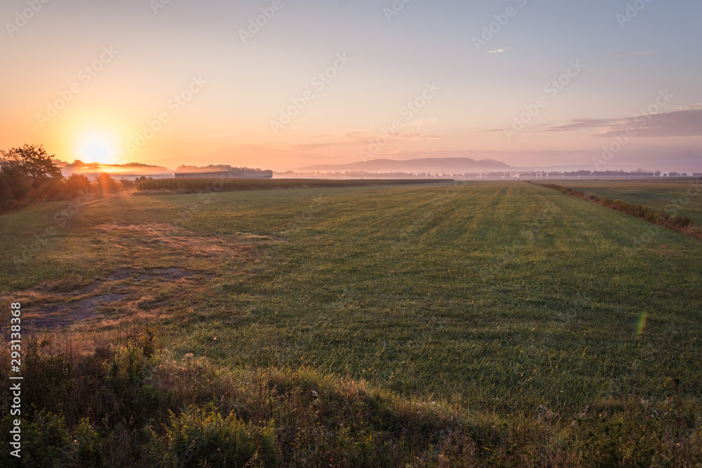 Sunrise over a farm field, Pine Island, NY, early fall Sunrise over a farm field, Pine Island, NY, early fall