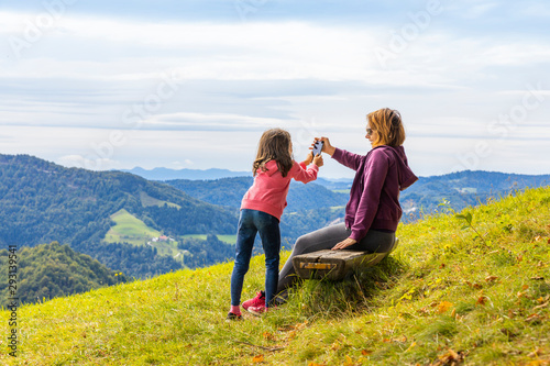 Modern lifestyle in the nature. Active mother and daughter.