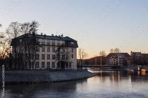 View of the river embankment in the city of Wroclaw at sunset. Poland