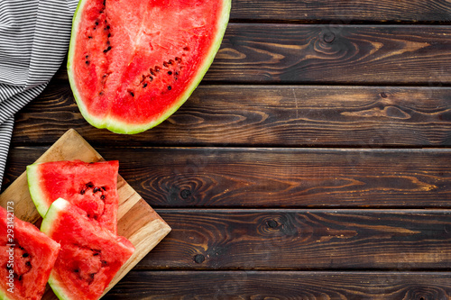 Fresh watermelon on wooden background top view copyspace