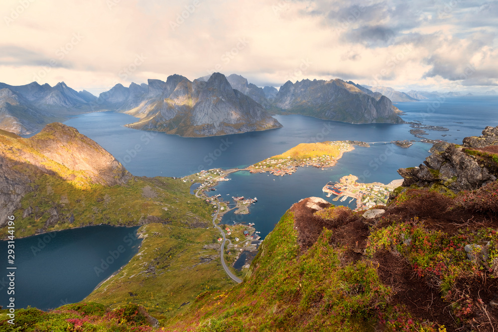 Lofoten Islands, Norway, panorama of the city of Reine  from the top of the Reinebringen mountain in sunny autumn day