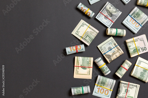 Pile of one hundred US Dollar Bills money on colored background top wiev with copy space for your text in financial concept