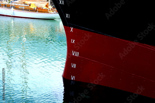 Plimsoll Line painted on a ship hull. An indication of the maximum depth to which the ship may be safely immersed when loaded with cargo. photo