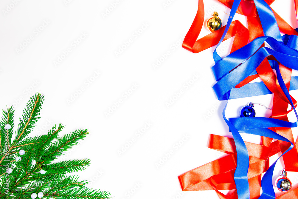 Obraz premium Christmas card on white background. satin ribbons on white background. the view from the top