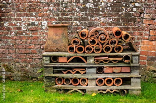 A large bee and insect hotel made from terracotta pots and wood pallettes  photo