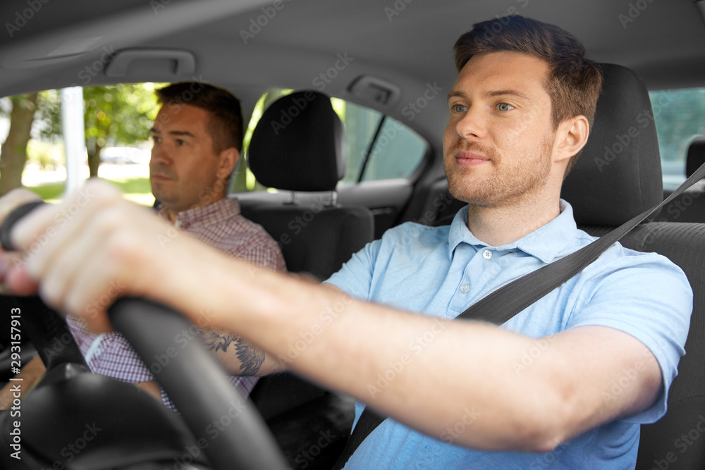 car driving lesson and carpooling concept - instructor on passenger seat and young driver car driving lesson and carpooling concept - instructor on passenger seat and young driver