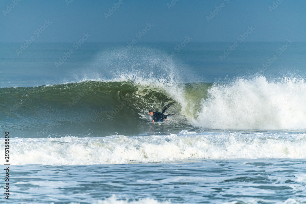 Bodyboarder surfing ocean wave Bodyboarder surfing ocean wave