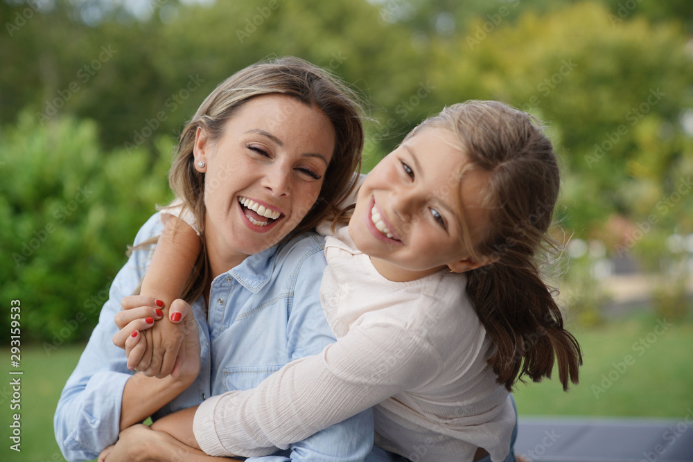Portrait of cheerful mother and daughter Portrait of cheerful mother and daughter