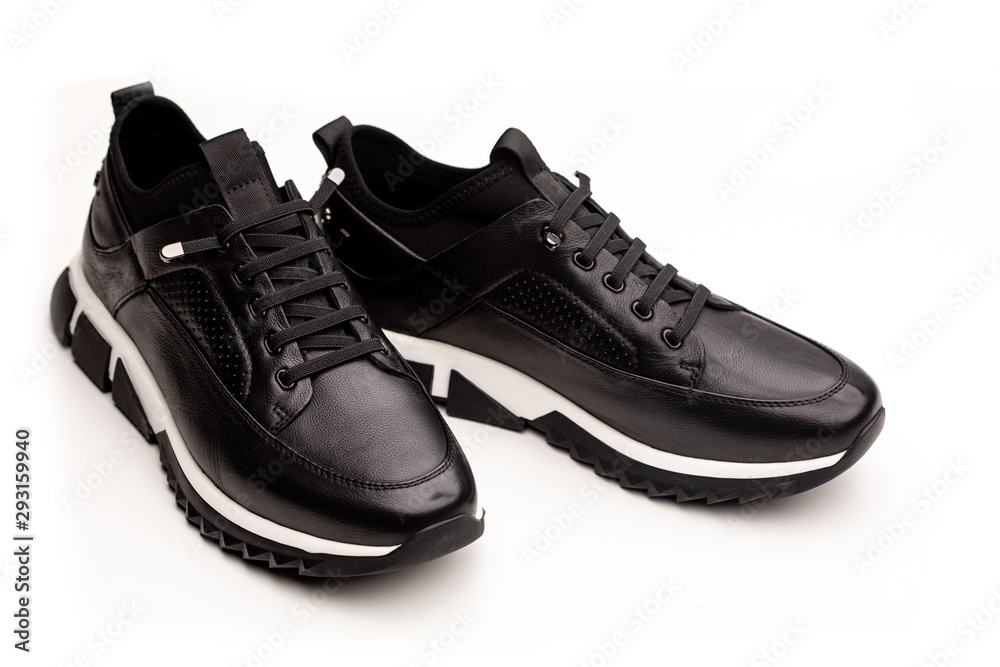 Black leather men's sneakers isolated on white background Black leather men's sneakers isolated on white background