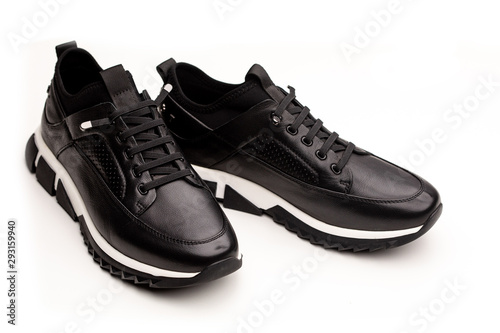 Black leather men's sneakers isolated on white background