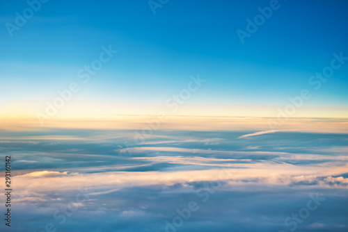 Cloudscape with clear blue sky and fluffy clouds, view from above © Pavlo Vakhrushev