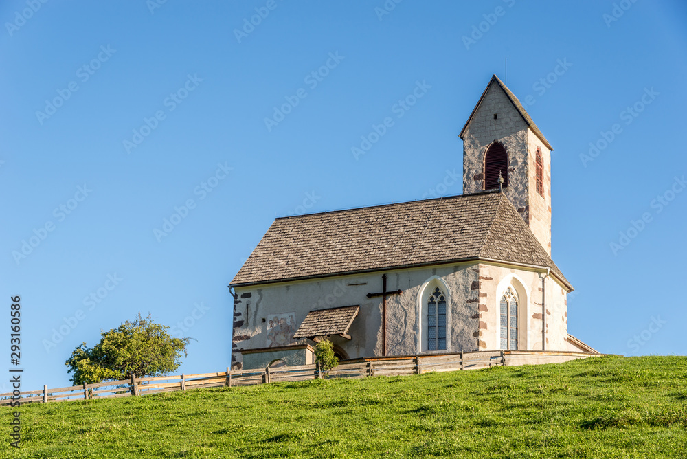 Obraz premium View at the Church of Saint Jacob (San Giacomo) in San Pietro village - Dolomites ,Italy