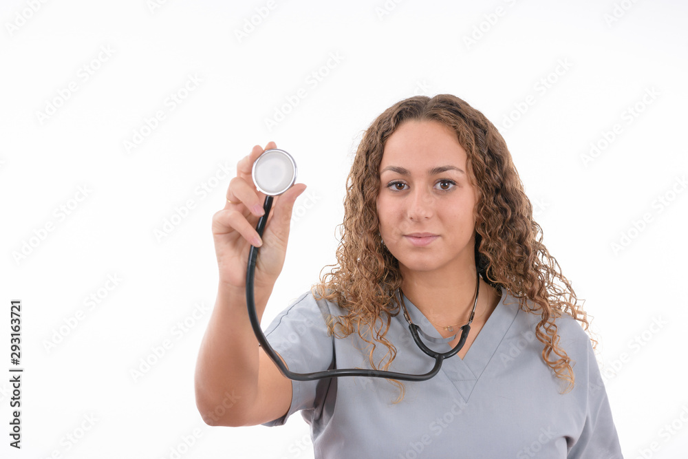 Young caucasian nurse with white coat and stethoscope on white background isolated Young caucasian nurse with white coat and stethoscope on white background isolated