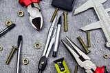 Tools Sets Cutting pliers Wrenches Screwdrivers Pliers Clamps blueprint on Cement Wall Background Construction or electrician architectural Concept