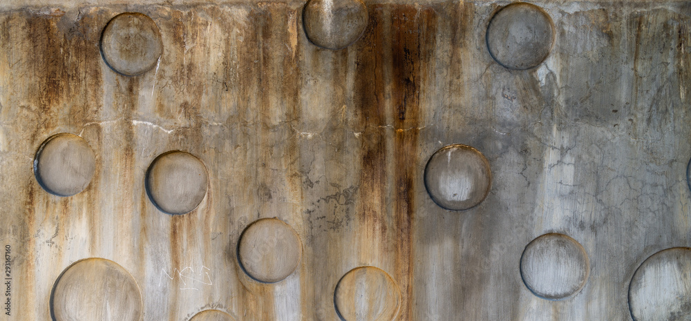 Building concrete facade with round holes