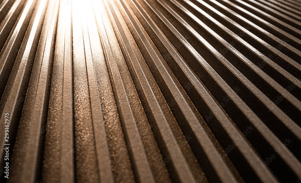 Obraz premium Close-up of a golden corrugated metal surface