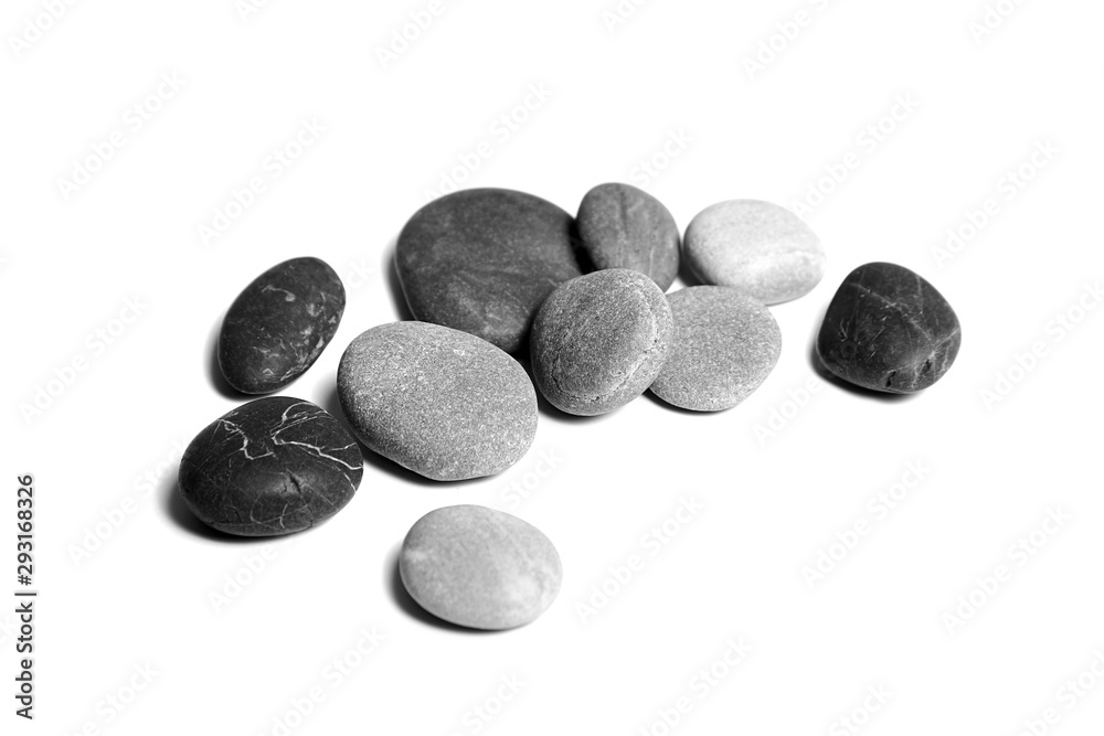 Sea pebbles. Heap of smooth gray and black stones isolated on white background Sea pebbles. Heap of smooth gray and black stones isolated on white background