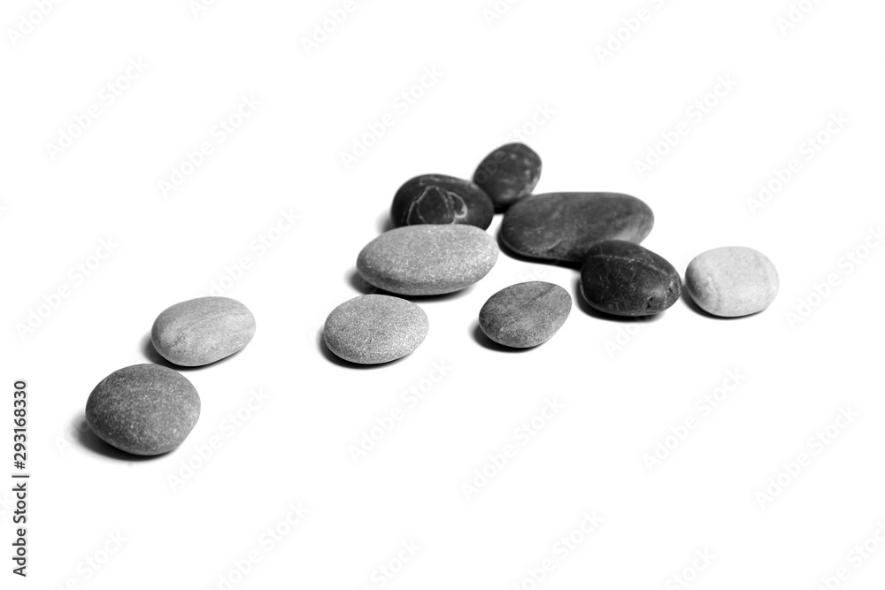 Sea pebbles. Heap of smooth gray and black stones isolated on white background Sea pebbles. Heap of smooth gray and black stones isolated on white background