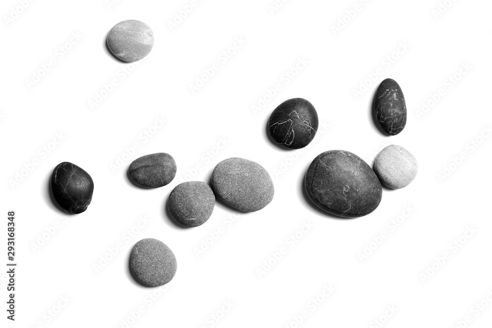 Sea pebbles. Heap of smooth gray and black stones isolated on white background, top view Sea pebbles. Heap of smooth gray and black stones isolated on white background, top view