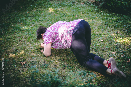 Senior woman felt on her knees outdoors