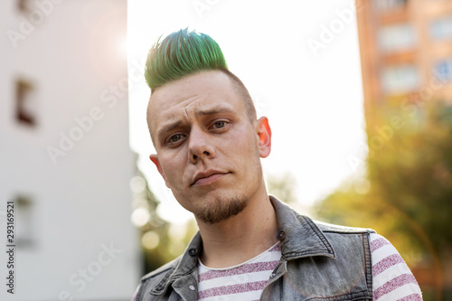 Young punk man in a public housing estates photo