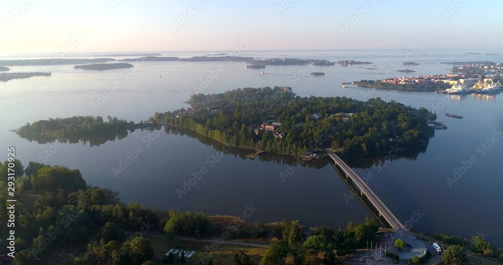 Korkeasaari zoo island, Aerial, static, drone shot, of a animal park, on a isle, on a sunny and misty autumn morning dawn, in Helsinki, Uusimaa, Finland
