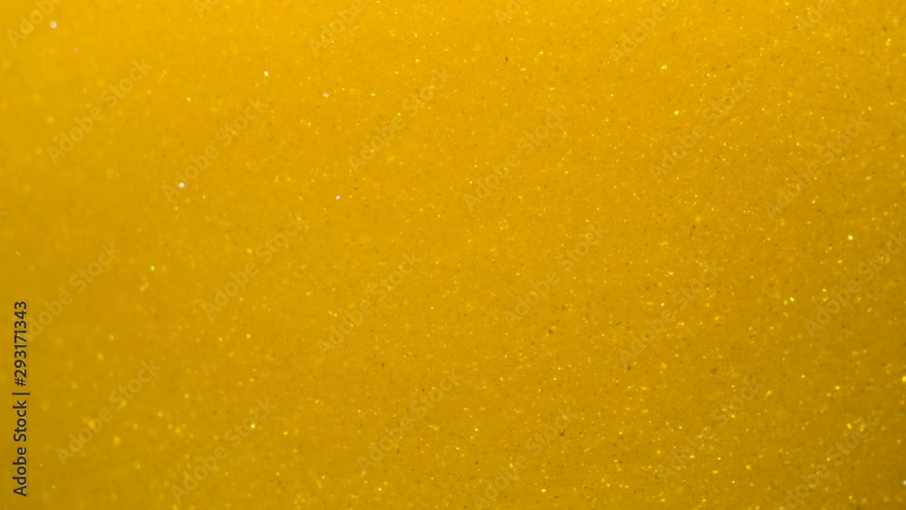 Golden Wave Background. Art Gold Background. Golden Sand , Dust Creating Abstract Cloud Formations. Slow Motion. Gold Texture. Amazing Metamorphosis Sparkle Shiny Particles Flow With Underwater. Golden Wave Background. Art Gold Background. Golden Sand , Dust Creating Abstract Cloud Formations. Slow Motion. Gold Texture. Amazing Metamorphosis Sparkle Shiny Particles Flow With Underwater.