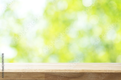 Empty white table and blurred garden bokeh background. mock up for display or montage of product, Business presentation.