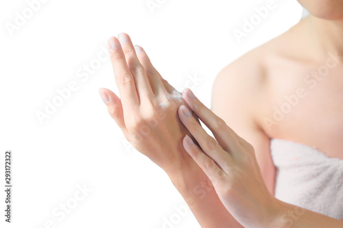 Woman applying moisturizing cream lotion on hands  beauty concept. 