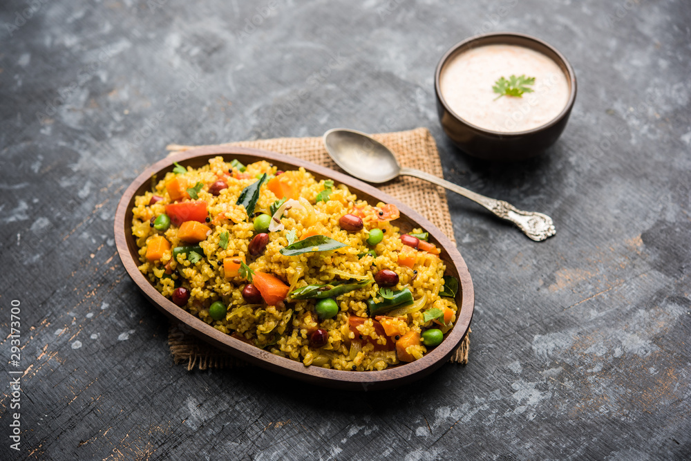 Broken wheat or Daliya Upma, served in a bowl. selective focus Broken wheat or Daliya Upma, served in a bowl. selective focus