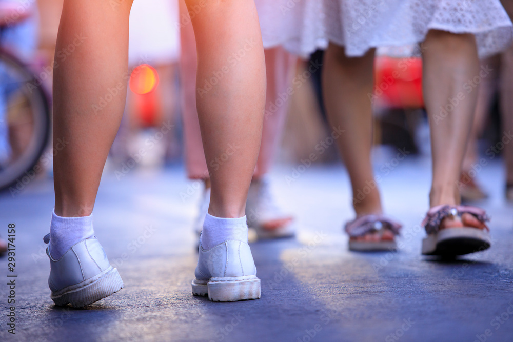 Closeup of young woman legs and shoes on street in the city, woman, walking street