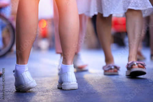 Closeup of young woman legs and shoes on street in the city, woman, walking street