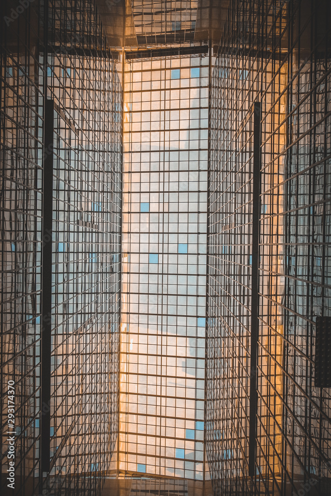 Fototapeta premium Glass roof in which you can see the sunset and blue sky