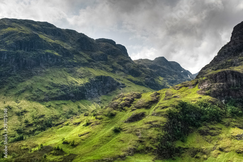 Amazing mountains surrounding Glencoe valley on a sunny day, Highlands, Scotland, UK