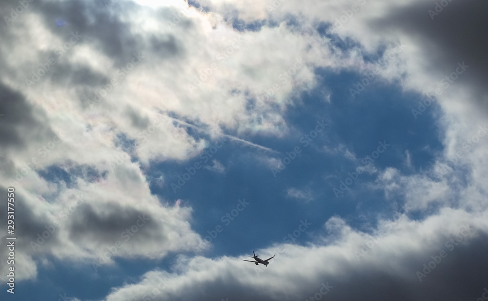 plane silhouette over sky