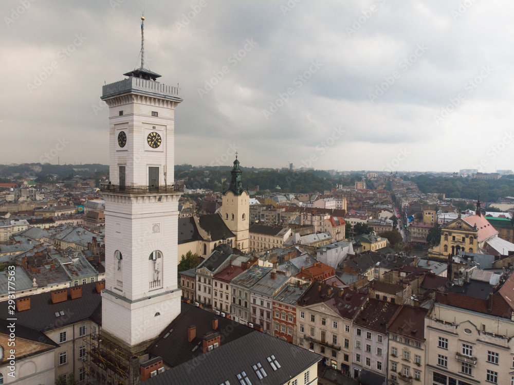 aerial view of european central square with bell tower overcast rainy weather