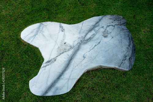 Floor slabs on the lawn. marble on green grass background. photo