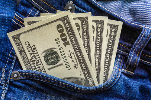 Dollar money in the  pocket of jeans. Banknote One hundred dollar. The concept of finance. Close-up. Copy space. for your background.