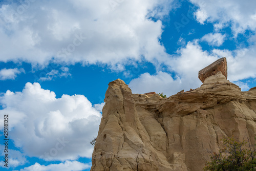 Ojito Wilderness low angle landscape of vertical rock formation against the sky in New Mexico photo