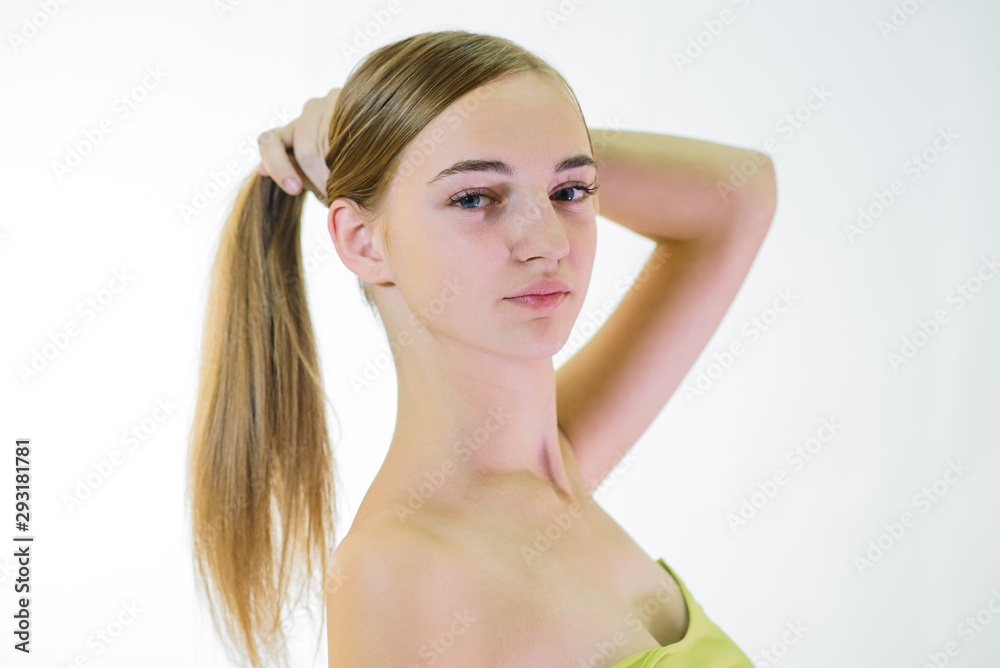 Naklejka premium Beautiful young fair-haired girl with well-groomed skin. Studio shot